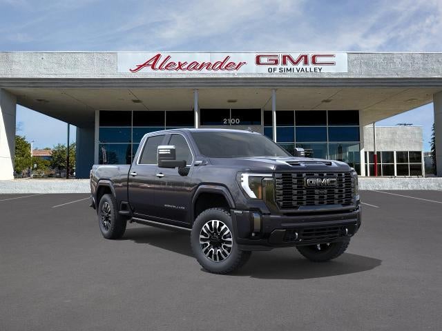 2026 GMC Sierra 2500 HD Denali Ultimate in Titanium Rush Metallic — front three-quarter view