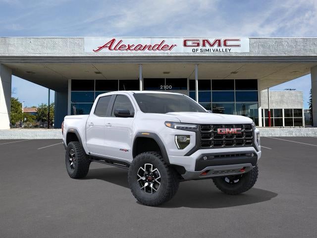2026 GMC Canyon AT4X in Summit White — front three-quarter view